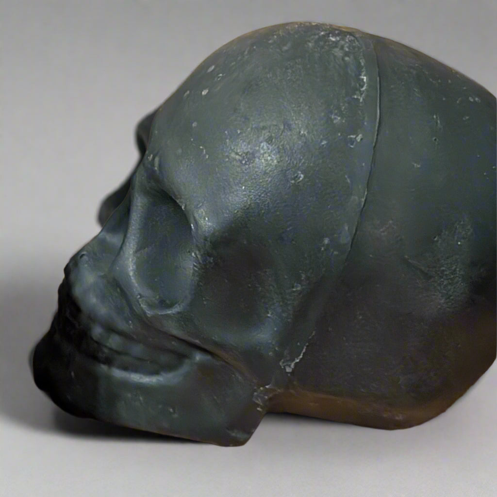 close up of sculpted skull black charcoal soap