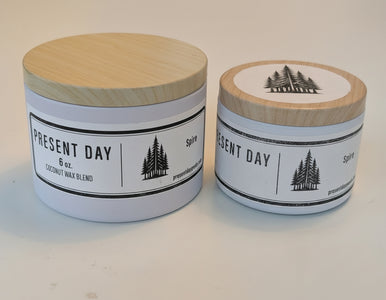 Two Spire candle tins side by side large and small