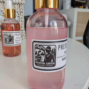 Hudson Santal icon label on a bottle of body spritz spray
