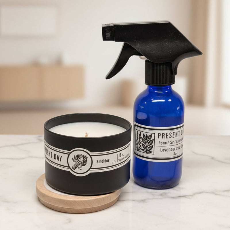 Candle and spray bottle on a checkered surface