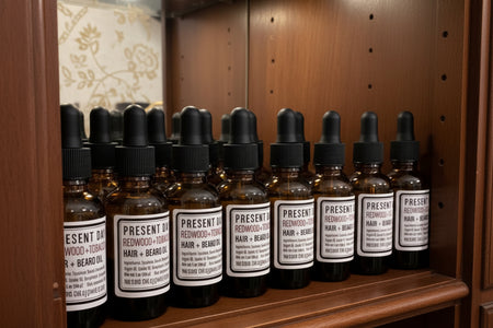 Bottles of Present Day Redwood + Tobacco Hair and Beard Oil on a shelf.