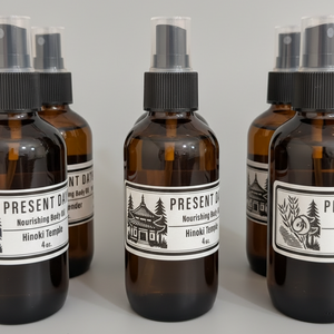 Set of brown bottles with black caps and labels on a gray background