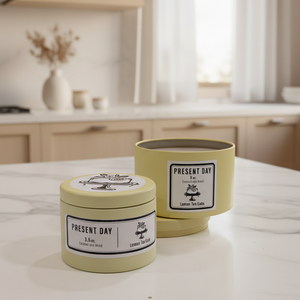 Two candles labeled 'Present Day' on a kitchen counter.