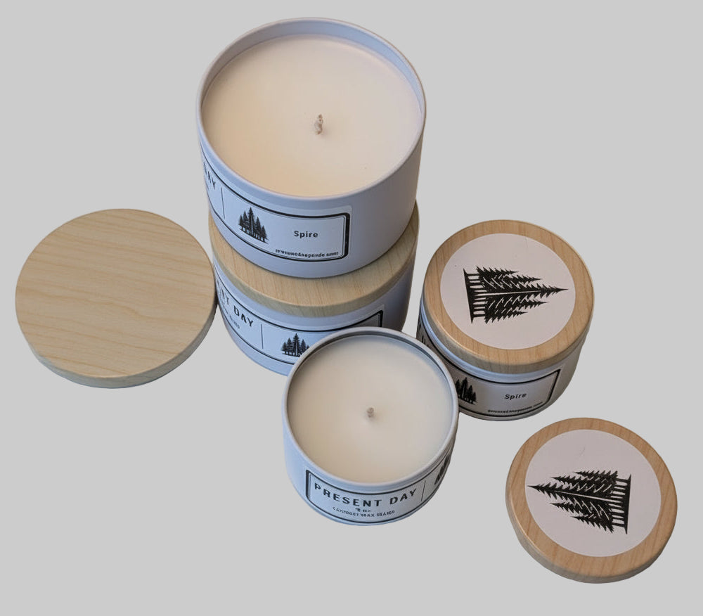 Set of candles with wooden print tin lids on a light surface