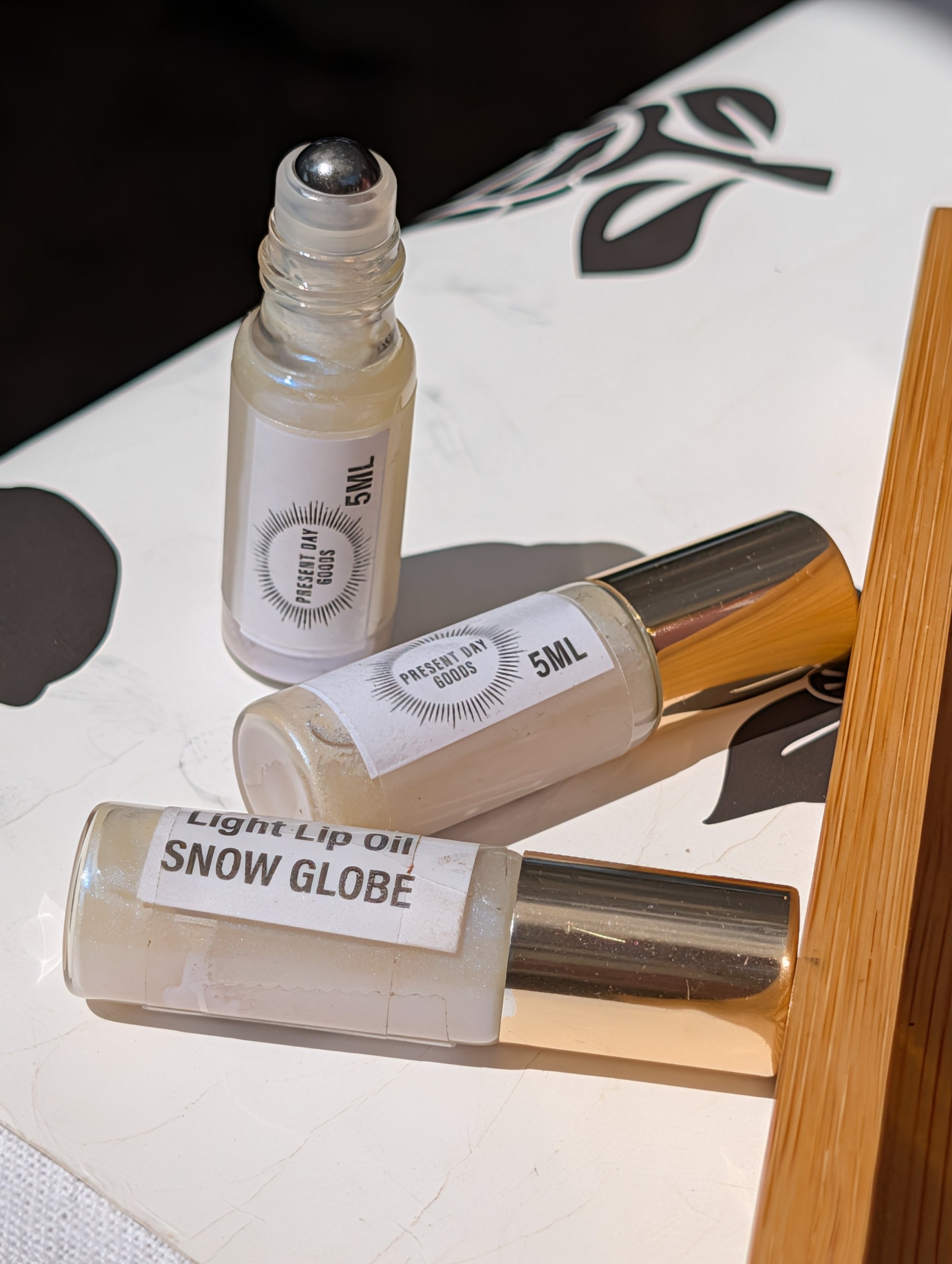 Snow Globe Light Lip Oil Rollerball — Sheer Shimmer, 5ml