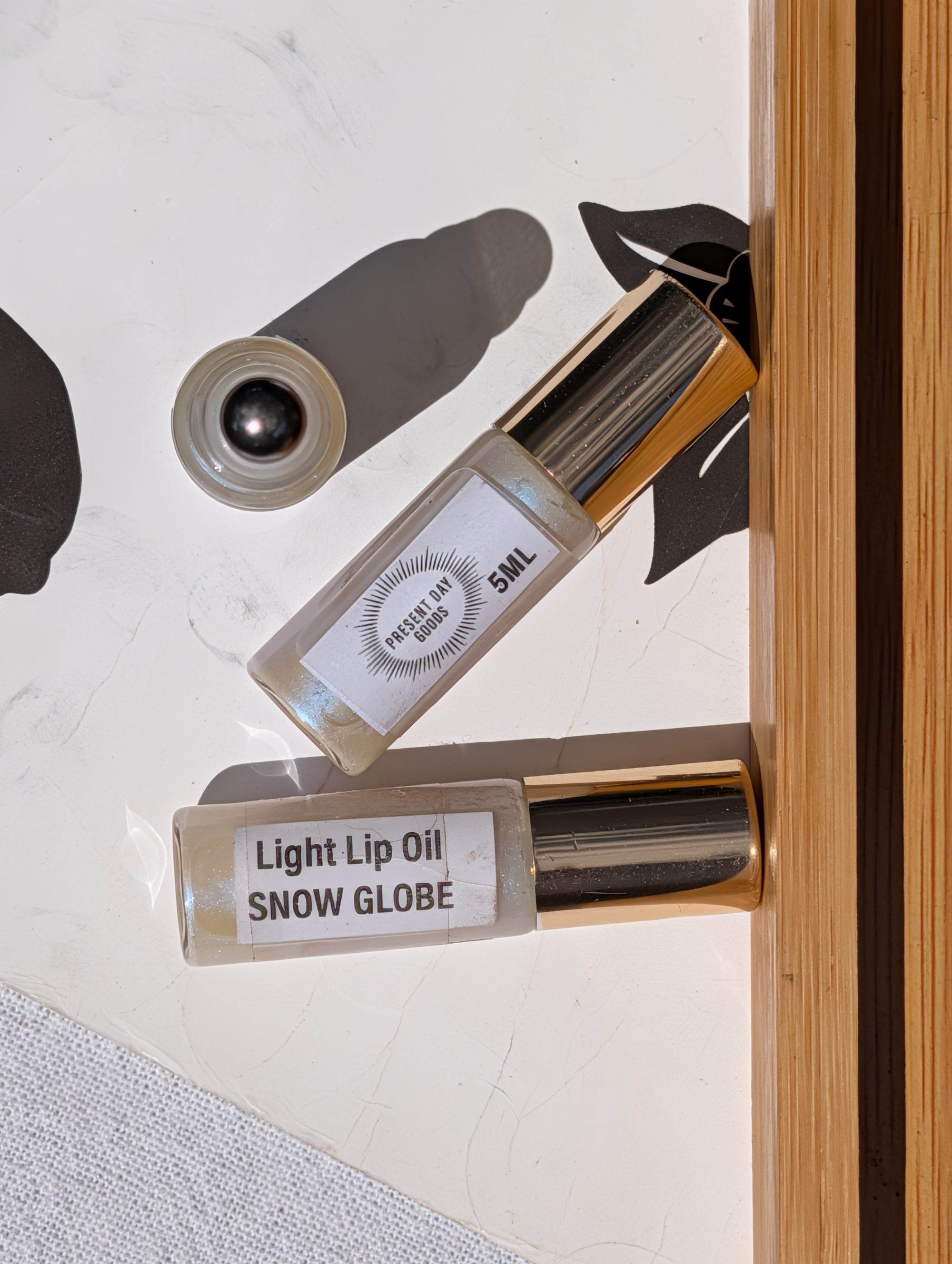 Snow Globe Light Lip Oil Rollerball — Sheer Shimmer, 5ml