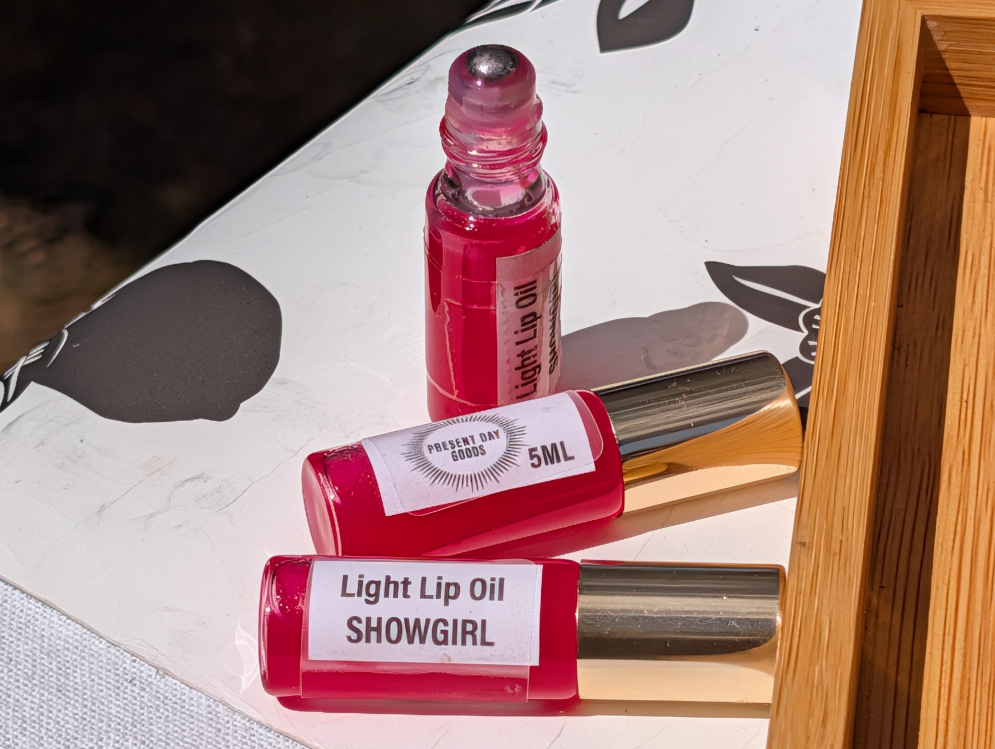 Showgirl Light Lip Oil Rollerball — Sheer Tint, 5ml