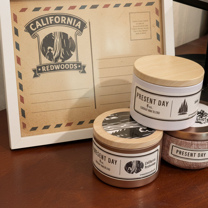 Candles with tin lids on a wooden surface next to a framed sign about candles.